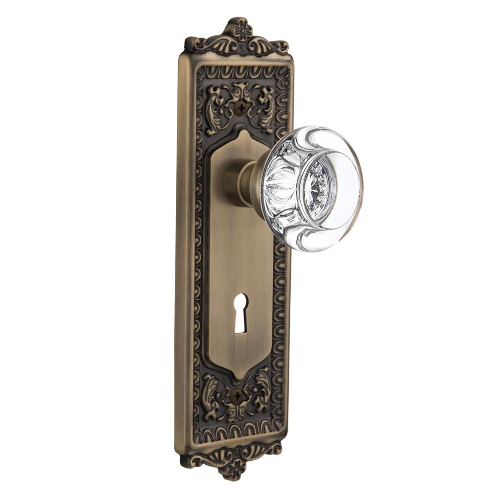 Nostalgic Warehouse EADRCC Passage Knob Egg and Dart Plate with Round Clear Crystal Knob with Keyhole in Antique Brass